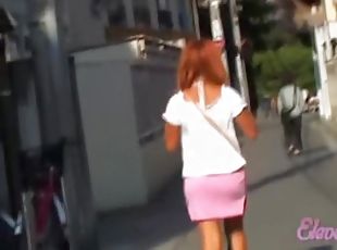 Adoring vivacious chick walking in the street while meeting some sharking guy